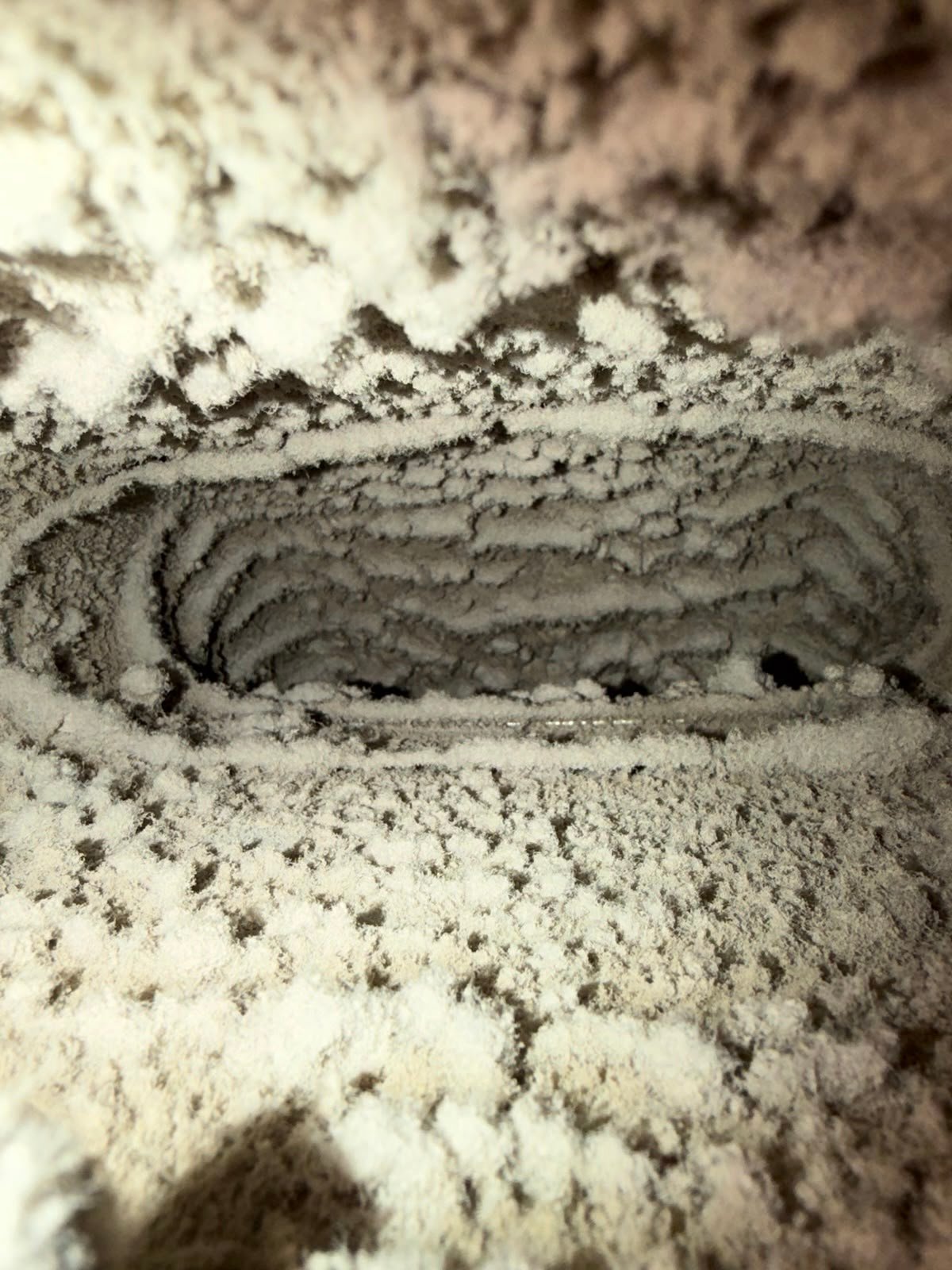 Dust and debris inside a home air duct before AMG cleaning