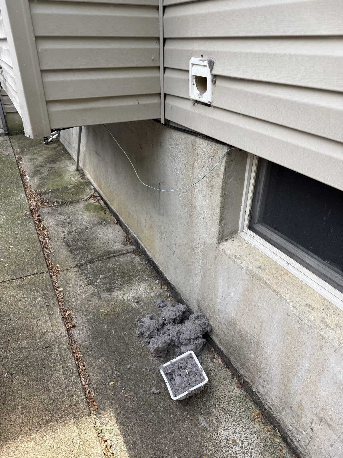 An exterior wall vent serviced by AMG. AMG at work for homes in Jersey City, New Jersey.