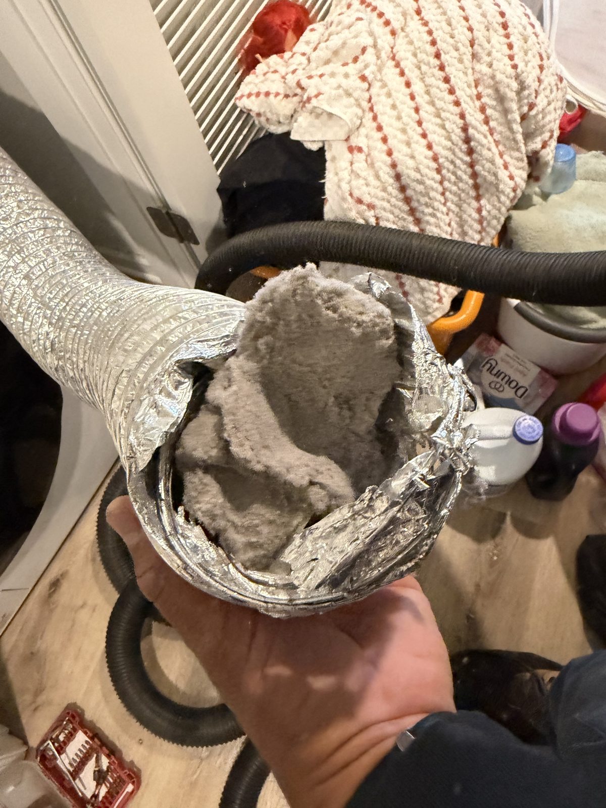 A lint packed dryer hose removed by AMG. AMG at work for homes in New Brunswick, New Jersey.