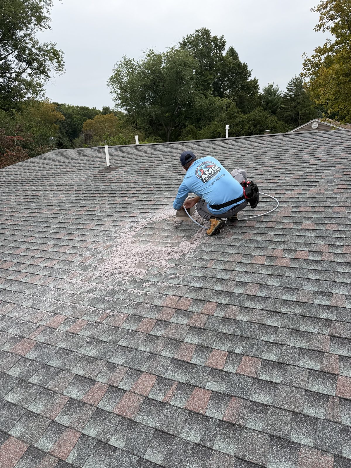 An AMG technician working on a New Jersey roof. AMG at work for homes in Parsippany, New Jersey.