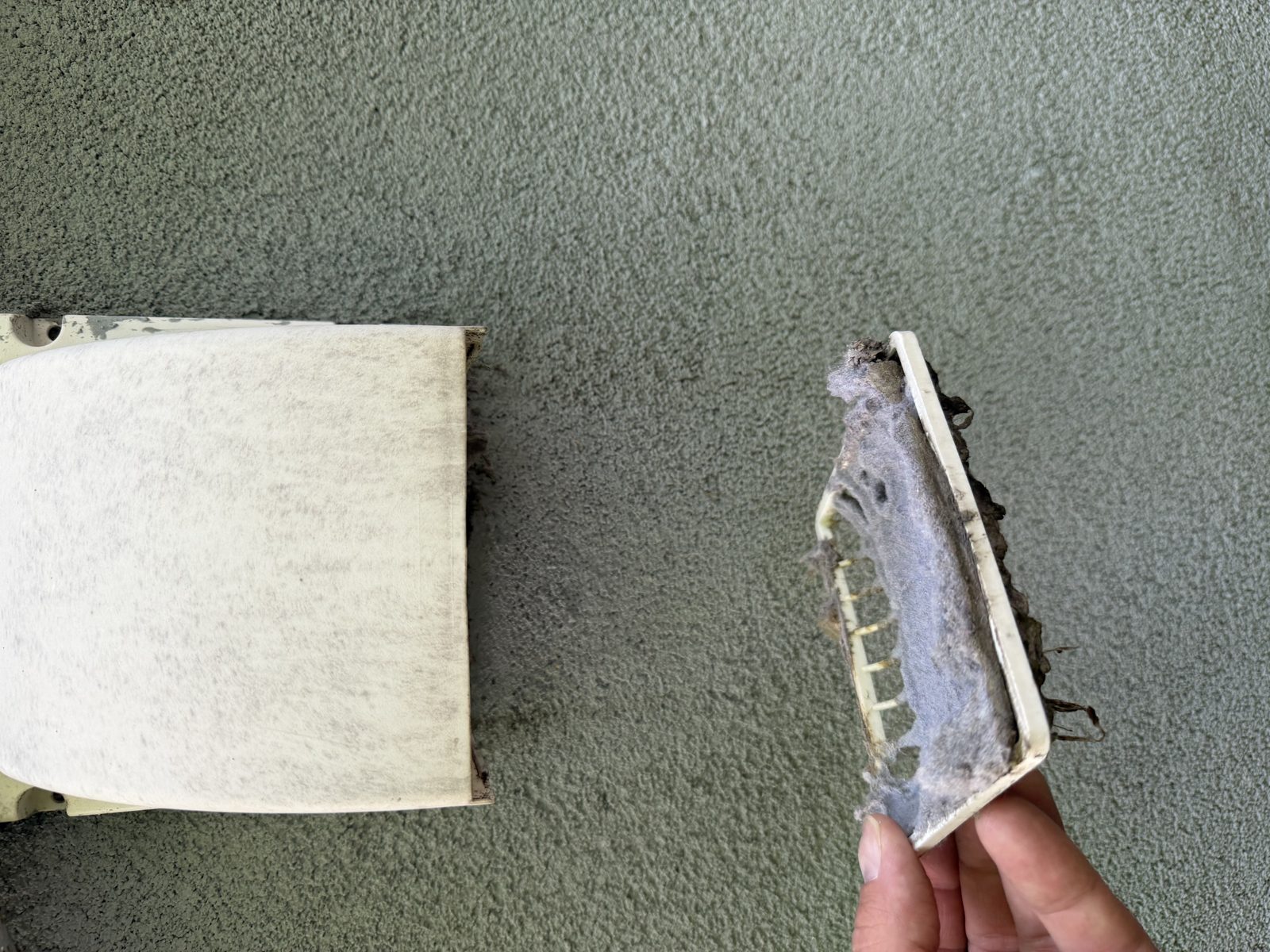 A return filter held up by an AMG technician. AMG at work for homes in Middletown, New Jersey.