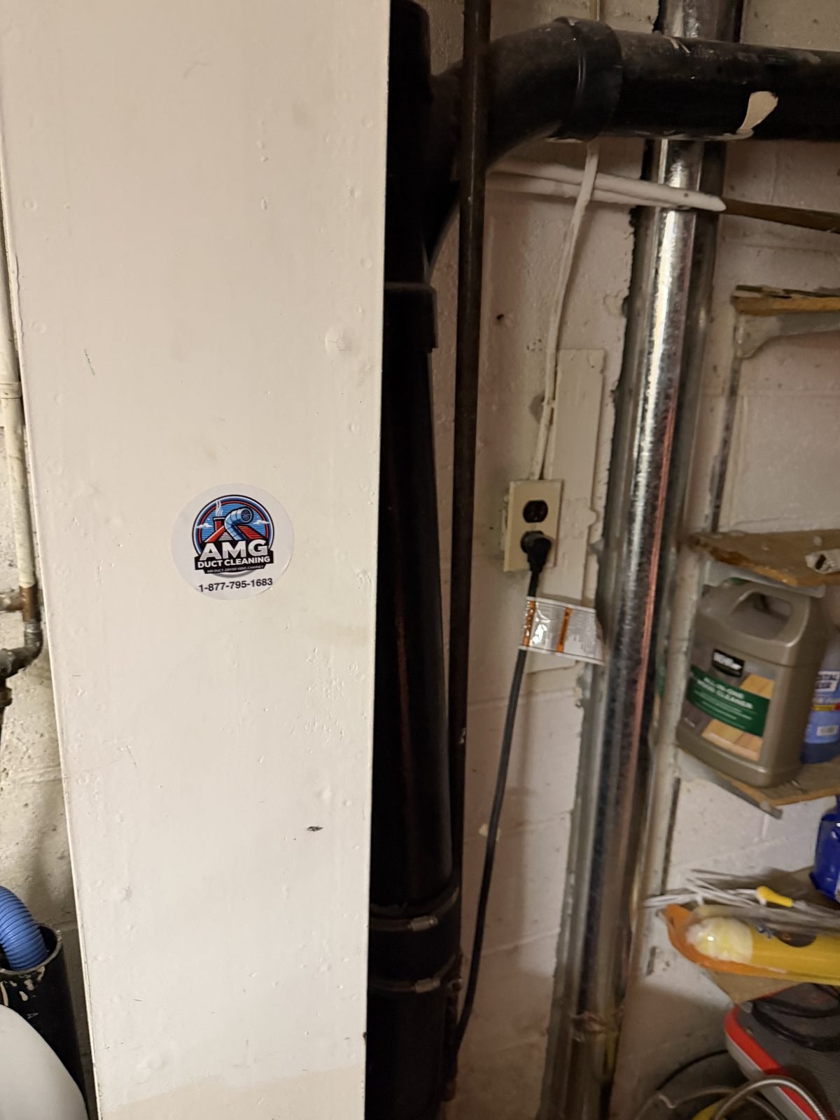 Dryer exhaust pipes serviced by AMG in a garage. AMG at work for homes in Hackensack, New Jersey.