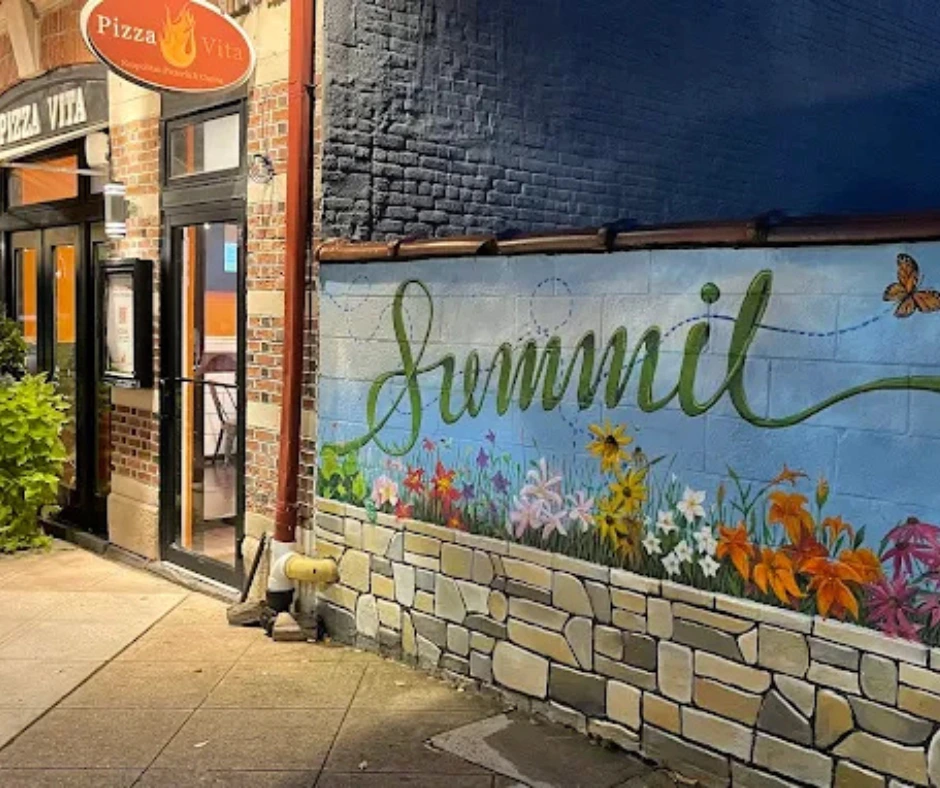 Interior of the Visual Arts Center in Summit, NJ, featuring walls filled with diverse art exhibits and spaces for cultural activities and creative workshops.